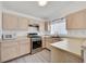 Well-lit kitchen featuring stainless steel appliances and light wood cabinetry at 1356 Pleasant Brook St, Las Vegas, NV 89142