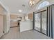 Open kitchen featuring stainless steel appliances, a breakfast bar, and easy access to the backyard at 1356 Pleasant Brook St, Las Vegas, NV 89142