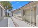 Charming side entrance with a security gate and well-maintained walkway leading to the front at 1356 Pleasant Brook St, Las Vegas, NV 89142