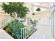 Sunlit atrium with a staircase, indoor plants, and tiled flooring creating a tranquil, unique space at 1409 Pueblo Dr, Boulder City, NV 89005