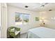 Bedroom with ceiling fan, mountain views, and decorative chair at 1409 Pueblo Dr, Boulder City, NV 89005