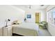 Bedroom with ceiling fan, view to a balcony and mountain views at 1409 Pueblo Dr, Boulder City, NV 89005