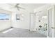 Bright bedroom features a door to a private balcony with mountain views at 1409 Pueblo Dr, Boulder City, NV 89005