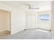 Bright bedroom with a ceiling fan and views of mountains at 1409 Pueblo Dr, Boulder City, NV 89005