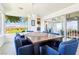 Bright dining room with table for six features view of the desert landscape at 1409 Pueblo Dr, Boulder City, NV 89005