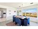 Inviting dining room with a large window overlooking beautiful landscape views and room for six at 1409 Pueblo Dr, Boulder City, NV 89005