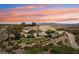 Expansive home with desert landscaping, and a beautiful sunset backdrop for peaceful living at 1409 Pueblo Dr, Boulder City, NV 89005