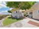 Charming home exterior with patio seating and a well-manicured lawn, ideal for outdoor relaxation at 1409 Pueblo Dr, Boulder City, NV 89005