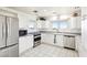 Bright kitchen with white cabinets, stainless steel appliances, and a scenic view at 1409 Pueblo Dr, Boulder City, NV 89005