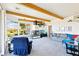 Bright living room features high ceilings, exposed wood beams, fireplace, and panoramic views at 1409 Pueblo Dr, Boulder City, NV 89005