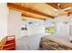 Spacious main bedroom with wooden ceiling and bar area with outside access and view at 1409 Pueblo Dr, Boulder City, NV 89005