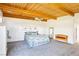 Large main bedroom with exposed beam ceilings, neutral paint, soft carpet and nice light at 1409 Pueblo Dr, Boulder City, NV 89005