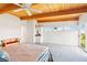 Spacious main bedroom with a beamed ceiling, lots of light, and scenic views from a large window at 1409 Pueblo Dr, Boulder City, NV 89005