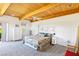 Spacious main bedroom with wooden ceiling, wardrobe, and outside access at 1409 Pueblo Dr, Boulder City, NV 89005