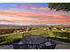 Outdoor seating area features a wrought-iron table and chairs with a stunning view of the valley at 1409 Pueblo Dr, Boulder City, NV 89005