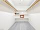 Walk-in closet with white walls, neutral carpet, and custom shelving at 1409 Pueblo Dr, Boulder City, NV 89005