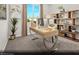 Bright secondary bedroom with a modern desk, stylish decor, and a large window providing lots of natural light at 145 Harmonica Ave # Lot 23, Henderson, NV 89015