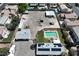 Aerial view of the property featuring a pool, ample parking and storage buildings at 1595 E Camero Ave, Las Vegas, NV 89123