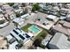 Aerial view of property featuring a pool, ample parking, and outbuildings at 1595 E Camero Ave, Las Vegas, NV 89123