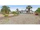 Beautiful backyard with ample space, an outdoor pergola, and mature palm trees providing shade at 1595 E Camero Ave, Las Vegas, NV 89123