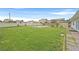 Expansive backyard with a swimming pool and green lawn at 1595 E Camero Ave, Las Vegas, NV 89123