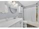 Full bathroom features a shower-tub combination and updated vanity at 1595 E Camero Ave, Las Vegas, NV 89123
