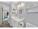 Stylish bathroom featuring a large sink vanity and mirrored medicine cabinet at 1595 E Camero Ave, Las Vegas, NV 89123