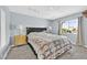 Bright bedroom with a queen-sized bed, carpet, and side tables with lamps at 1595 E Camero Ave, Las Vegas, NV 89123