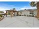 Charming exterior featuring an RV parking area, covered patio, and well-maintained landscaping at 1595 E Camero Ave, Las Vegas, NV 89123