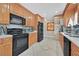 This kitchen is equipped with stainless steel appliances and beautiful wood cabinets at 1595 E Camero Ave, Las Vegas, NV 89123