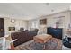 Comfortable living space featuring a stone fireplace, cozy furnishings, and warm, inviting decor at 1595 E Camero Ave, Las Vegas, NV 89123