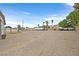 Expansive lot ready for development, boats and RVs, with mature trees and clear skies above at 1595 E Camero Ave, Las Vegas, NV 89123