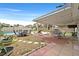 Outdoor patio with a barbecue grill and a view of the pool, lawn, and fence at 1595 E Camero Ave, Las Vegas, NV 89123