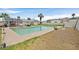 Backyard featuring a swimming pool, patio area, and landscaping, under a sunny sky at 1595 E Camero Ave, Las Vegas, NV 89123