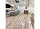 An open dining area featuring recessed lighting, bar area, wood floors, and a dining table at 1619 Tangerine Rose Dr, Las Vegas, NV 89142