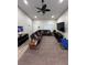 Spacious living room featuring neutral walls, ceiling fan, recessed lighting and carpeted floors at 1619 Tangerine Rose Dr, Las Vegas, NV 89142