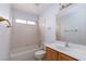 Cozy bathroom with a combined shower and tub, plus vanity storage at 1924 Coralino Dr, Henderson, NV 89074