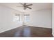 Bedroom featuring dark wood floors, neutral walls, and bright windows at 1924 Coralino Dr, Henderson, NV 89074