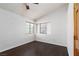 Bedroom with dark wood floors and bright windows at 1924 Coralino Dr, Henderson, NV 89074