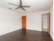 Bedroom featuring a ceiling fan, dark wood floors, and closet at 1924 Coralino Dr, Henderson, NV 89074