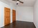 Neutral bedroom featuring dark wood floors and two entry doors at 1924 Coralino Dr, Henderson, NV 89074