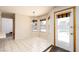 Bright breakfast nook with a view of the backyard pool through the glass door at 1924 Coralino Dr, Henderson, NV 89074