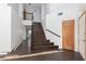 Hallway with stairs, wood-look floors and white walls at 1924 Coralino Dr, Henderson, NV 89074
