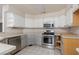 Functional kitchen with stainless steel appliances and ample cabinet space at 1924 Coralino Dr, Henderson, NV 89074