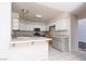Spacious kitchen featuring white cabinets and countertops, ready for renovation at 1924 Coralino Dr, Henderson, NV 89074