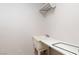 Simple laundry room space with a utility sink and potential for customization at 1924 Coralino Dr, Henderson, NV 89074
