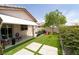 Landscaped backyard with covered patio, perfect for outdoor living and entertaining at 2021 Pelican Sky Beach Ave, North Las Vegas, NV 89081