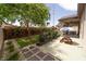 Spacious patio with a nice backyard featuring roses and pavers at 2021 Pelican Sky Beach Ave, North Las Vegas, NV 89081