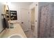 Bright bathroom with double sinks, and a shower/tub featuring a decorative shower curtain at 2021 Pelican Sky Beach Ave, North Las Vegas, NV 89081