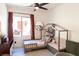 Cozy bedroom with a decorative bed frame, window, and stylish furnishings at 2021 Pelican Sky Beach Ave, North Las Vegas, NV 89081
